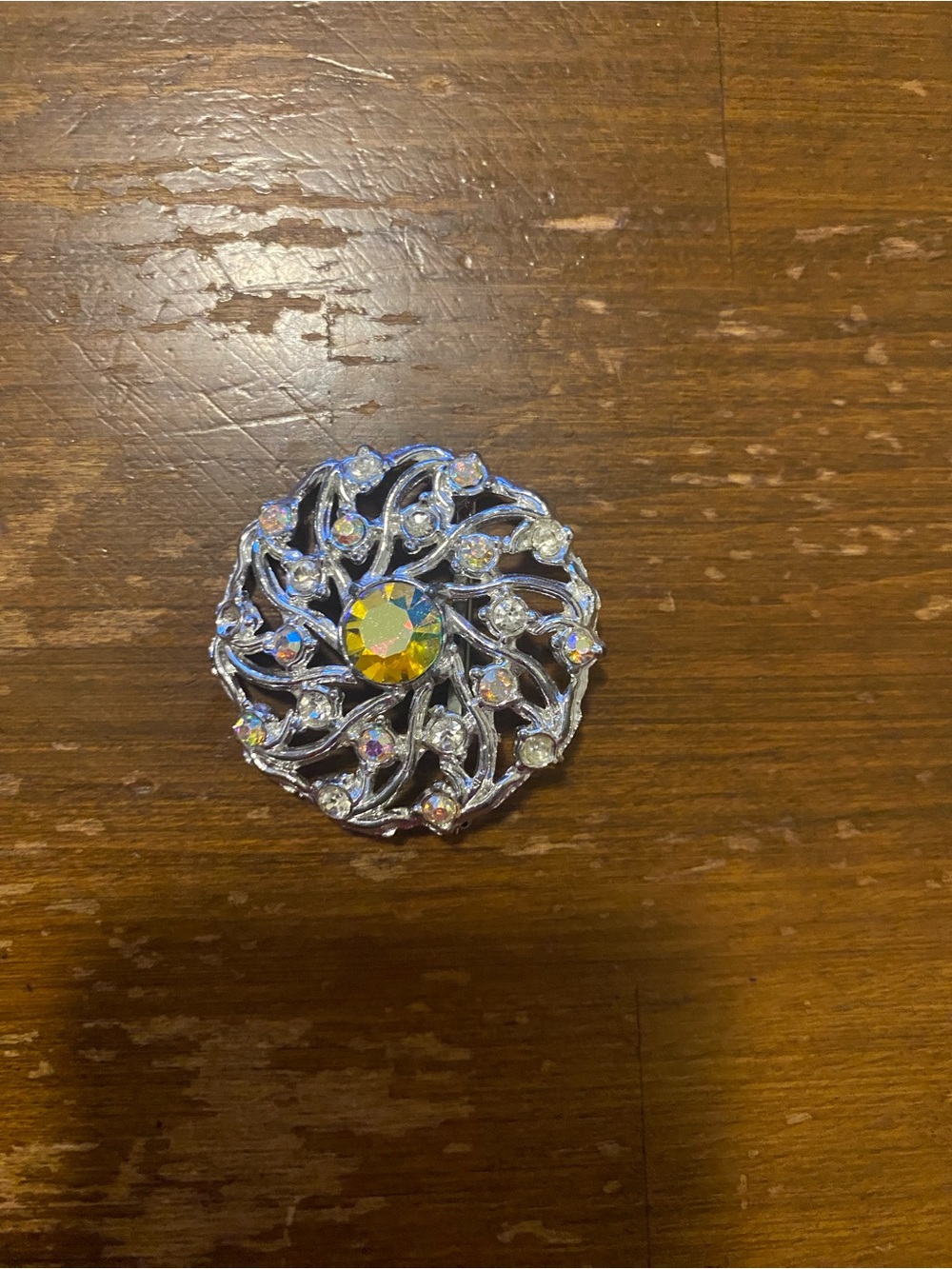 Silver-tone Aurora Borealis Round Brooch with Yellow Center Stone